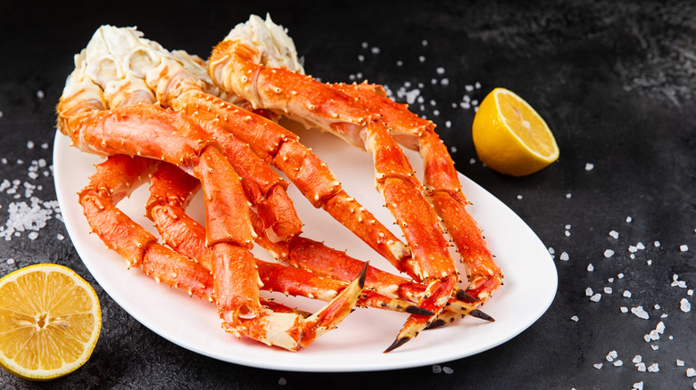 Crab,Legs,In,A,Plate,On,A,Dark,Background.,Ready