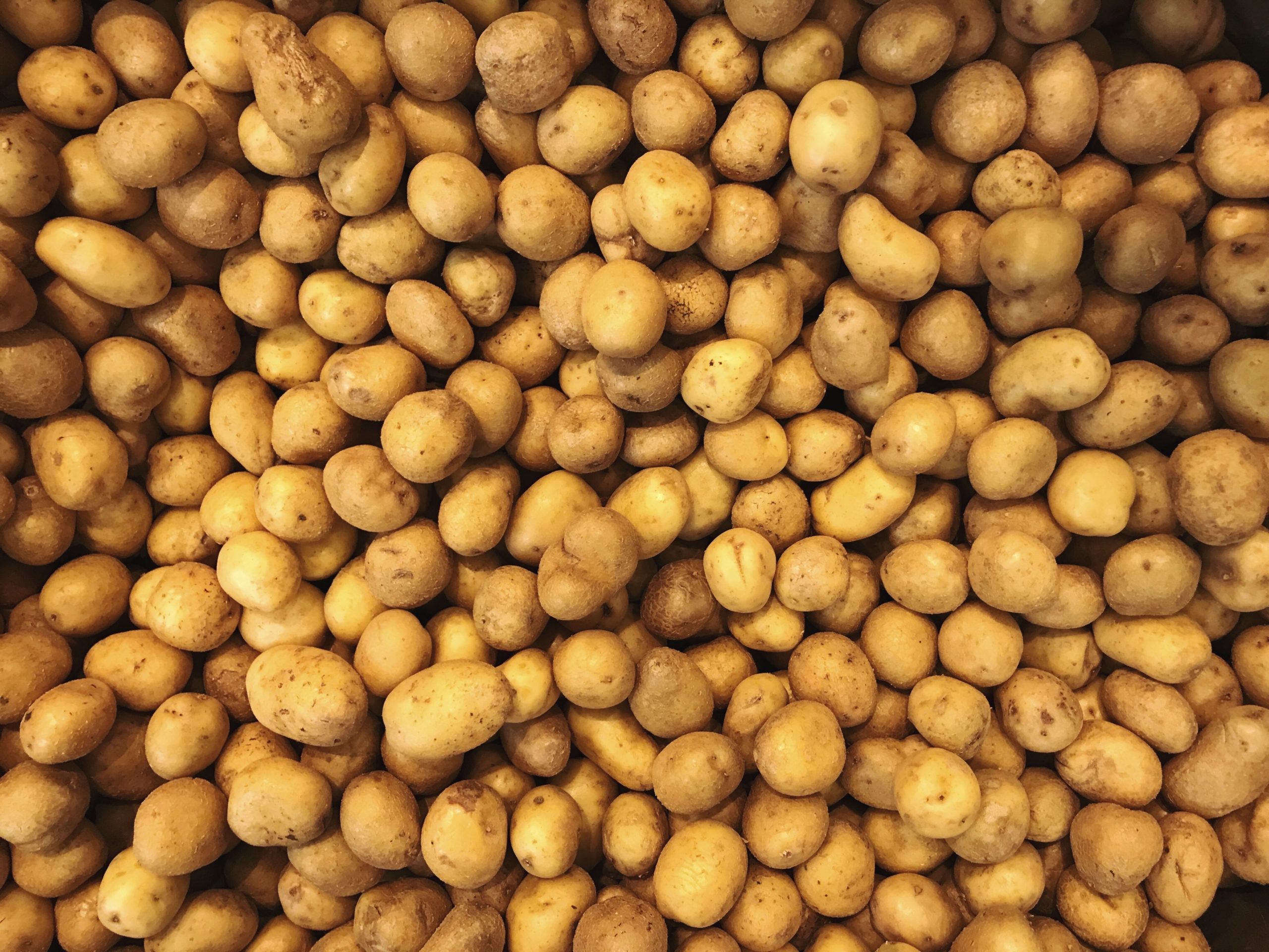 full-frame-shot-of-potatoes-at-market-royalty-