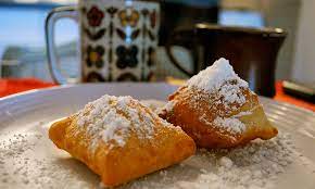 Where do the locals eat beignets in New Orleans?